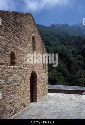 France. Pyrenees-Orientales. Languedoc-Roussillon region. Abbey of Saint-Martin-du-Canigou. Monastery built in 1009, on Canigou mountain. It was built from 1005-1009 by Guifred, Count of Cerdanya in Romanesque style. Main facade of the church. Restoration of 1900-1920. Stock Photo