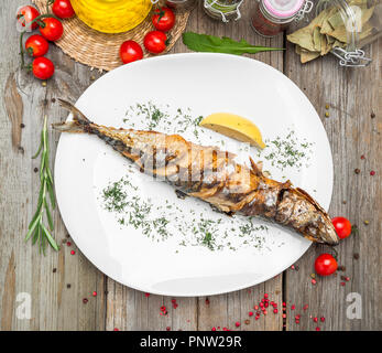 Oktoberfest menu. Grilled mackerel fish with beer and pretzel served Stock Photo