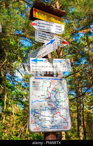 BIKE PATH NEAR OLKUSZ, POLAND - SEP 9, 2018: Map with cycling routes in green forest on sunny summer day. Southern Poland has many attractive bicycle  Stock Photo