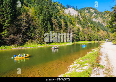 Rafts with tourist on Dunajec river in autumn landscape of Pieniny Mountains, Poland Stock Photo