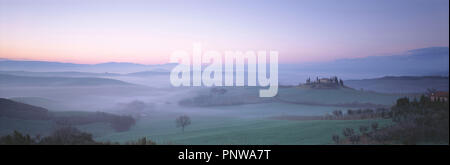 Italy. Tuscany. Early morning mist over panoramic landscape. Stock Photo