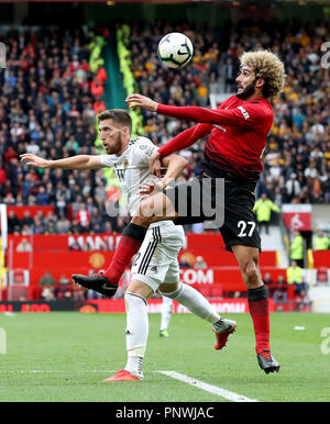 Manchester United's Marouane Fellaini (right) and Wolverhampton Wanderers' Matt Doherty (left) battle for the ball during the Premier League match at Old Trafford, Manchester.