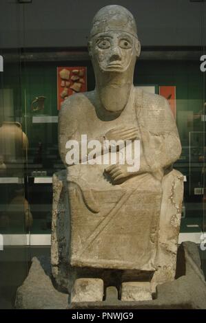 Stone statue of King Idrimi of Alalakh seated in his throne. 1570-1500 BC. British Museum. London. United Kingdom. Stock Photo