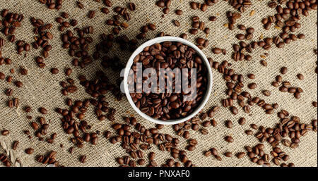 Bowl of coffee beans on canvas Stock Photo