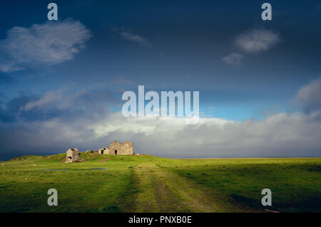 Landscape view of countryside with ruins of abandoned building, Iceland, Europe