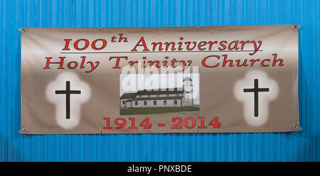 Banner celebrating the 100th anniversary of Holy Trinity Anglican Church on Highway 406 in Codroy, Newfoundland Stock Photo