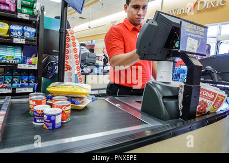 Miami Florida,Winn Dixie,grocery store supermarket,interior inside,food,checkout line queue,cashier,Hispanic man men male,employee job worker working,