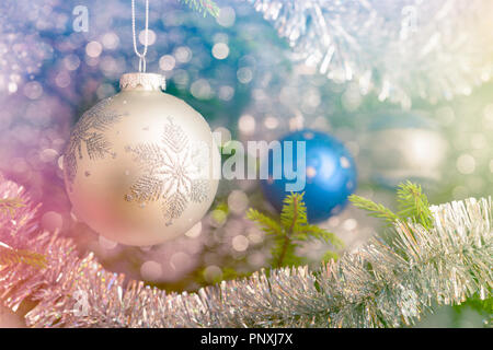 Christmas-tree decoration bauble on decorated Christmas tree bac Stock Photo