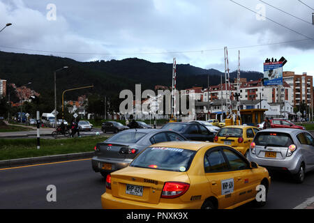 Bogotá, Colombia - May 01, 2017: Looking northwards on Carrera Novena or Avenue 9 in the capital city. Moving traffic on the road is seen. Stock Photo