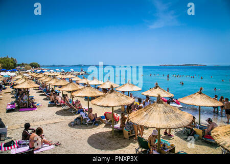 ATHENS, GREECE - JUNE 19, 2016: People on the Voullagmeni beach in ...