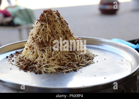 Norin, a local Uzbek noodle like pasta with small pieces of horse meat called 'Kazi'. Stock Photo