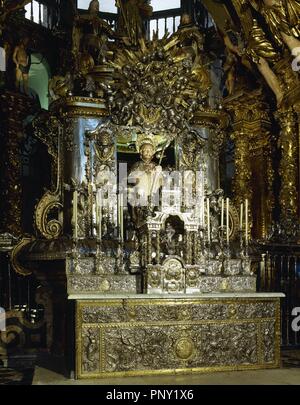 Main altar of the Cathedral of Santiago de Compostela. A bejeweled medieval stone statue of St. James (12th century). Remodeled, sitting on a silver chair and covered by a silver enclosure. Santiago de Compostela Cathedral. Santiago de Compostela, Province of La Coru–a, Galicia, Spain. Stock Photo