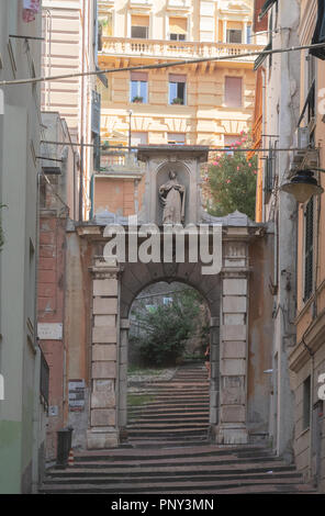 stairway in an ancient quarter of Genoa through an arch to reach the palaces. Italian architecture,Italy Stock Photo