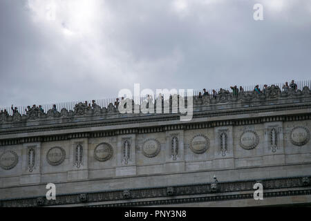 Tourists enjoying the view from Arc de Triomphe rooftop