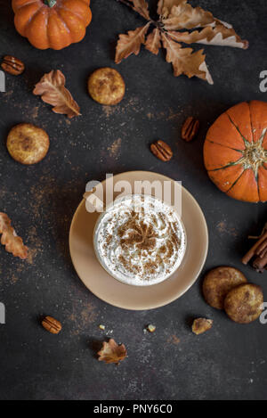 Overhead of pumpkin spice latte on plaid fall scarf with leaves Stock ...