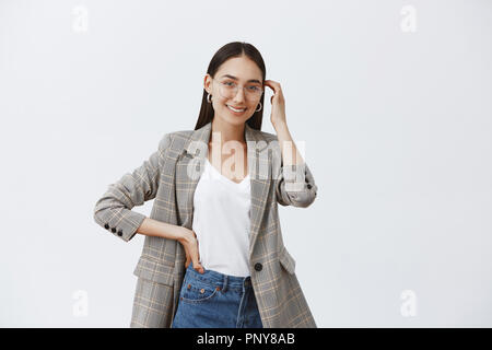 Successful Young Businesswoman Standing With Her Hand In Her Waist In Full  Length Pose, Isolated On White Background Stock Photo, Picture and Royalty  Free Image. Image 18062065.