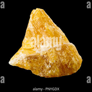 Raw, uncut yellow calcite (CaCO3) from Mexico isolated on black background Stock Photo