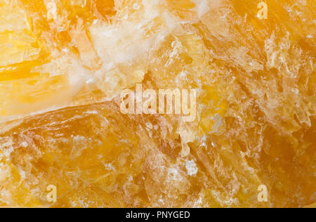 Raw, uncut yellow calcite (CaCO3) from Mexico close up frame filling texture Stock Photo