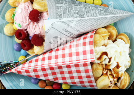 Hong Kong style egg waffle. bubble waffle with sundae ice cream and fruits. street food waffles Stock Photo