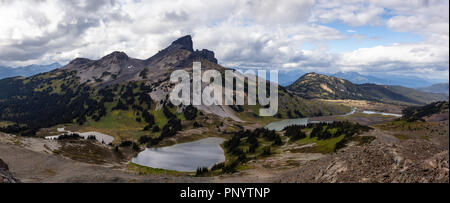 Beautiful panoramic Canadian Mountain Landscape view during a vibrant cloudy summer day. Taken in Garibaldi Provincial Park, located near Whister and  Stock Photo