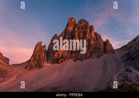 Awesome sunset on Dolomite mountain causing enrosadira effect, South Tyrol, Italy Stock Photo