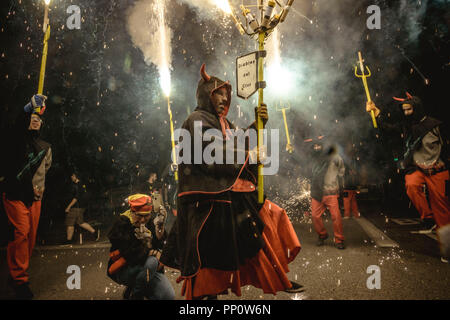Barcelona, Spain. 22 September, 2018:  'Correfocs' (fire runners) set off their fireworks during Barcelona's Fiesta Mayor (main festival), La Merce Credit: Matthias Oesterle/Alamy Live News Stock Photo