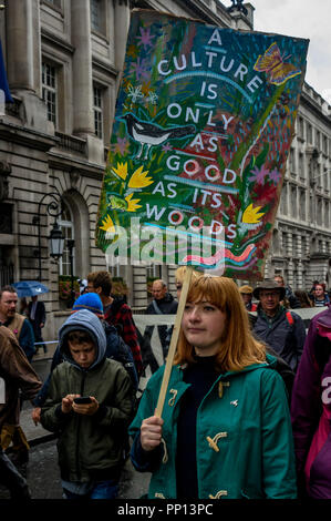 London, UK. 22nd Sep, 2018. 22 September 2018.A woman carries a painted poster with the message 'A Culture Is Only As Good As Its Woods'. Several thousands march through London on The Peoples Walk for Wildlife set up by naturalist and broadcaster Chris Packham to support the People's Manifesto for Wildlife drawn up by him with the aid of 17 independent experts and scientists aimed at halting the drastic decline in British wildlife. The even was supported by many NGOs, schools and environmental activists.  Credit: Peter Marshall/IMAGESLIVE/ZUMA Wire/Alamy Live News Credit: ZUMA Press, Inc./Alam Stock Photo