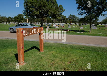 Sign alerting visitors to the location of the Buddy Holly burial site at the city's cemetery in Lubbock, Texas, USA. Stock Photo