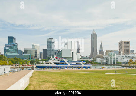 CLEVELAND - AUGUST 26: View of the Cleveland skyline from Voinovich Park on a mostly cloudy summer day on 2013 Aug. 26. Stock Photo