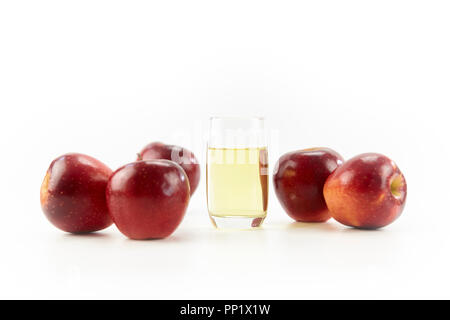 five apples and a glass of apple juice isolated on white background. Stock Photo