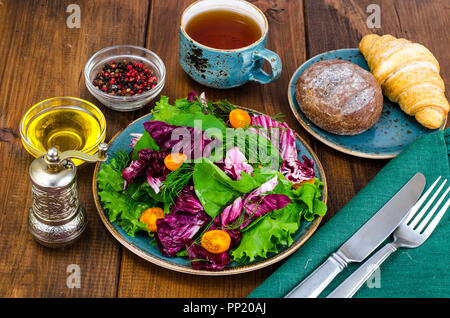 Mix of lettuce leaves with Radicchio on plate Stock Photo