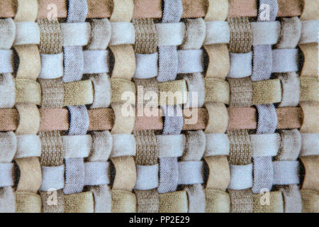pink blue and brown wicker fabric canvas for upholstery furniture indoor closeup Stock Photo