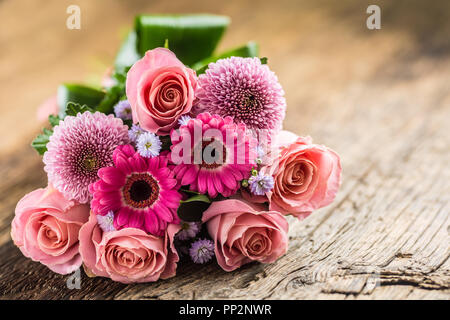 Close-up beautiful bouquet of flowers on wooden table. Stock Photo