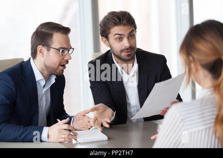Male recruiters surprised with job candidate experience Stock Photo