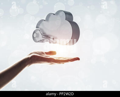 Cloud computing concept with glass symbol shown in hand Stock Photo