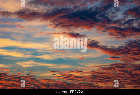 Colorful afterglow sky background with clouds Stock Photo