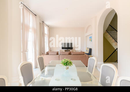 Modern living room with dining table set, interior home Stock Photo