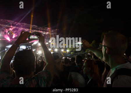 NOVI SAD, SERBIA - JULY 12, 2018: People raising their hands and making a Facebook live recording of the opening concert of the 2018 Exit festival, th Stock Photo