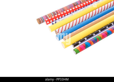 Rolls of multi-colored wrapping paper on a white background. Stock Photo
