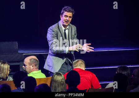 Magician and illusionist ADAM TRENT performs in Durham, North Carolina as part of his 2018 Tour.   Adam Trent is part of The Illusionists.   The Illusionists is a touring magic production which features a rotating cast of 5 to 8 magicians who all specialise in specific branches of magic from stage illusions to mind reading to escapology and comedic magic Stock Photo