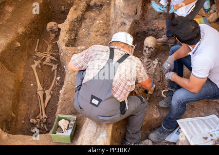 Excavation at the town hall parking lot in Pforzheim, Baden-Wuerttemberg, Germany, graves of a medieval settlement, monastery, archaeologists of the S Stock Photo