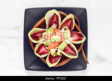 Red and White Chicory Salad with Avocados and Grapefruits Stock Photo