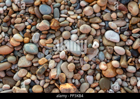 An abstract background of pebbles on the iconic Port Willunga Beach in South Australia on 22nd September 2018 Stock Photo