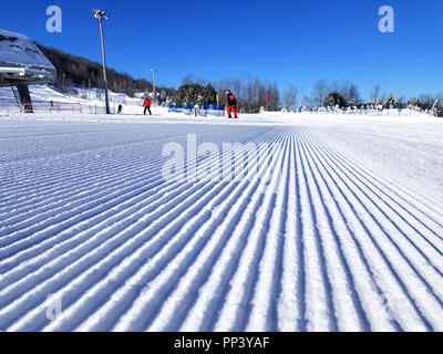 Groomed snow of alpine skiing trails at Saint-Sauveur, Quebec Stock Photo