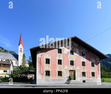 Holzgau: church, historic house Bürgerhaus (red), Lechtal Valley, Tirol, Tyrol, Austria Stock Photo