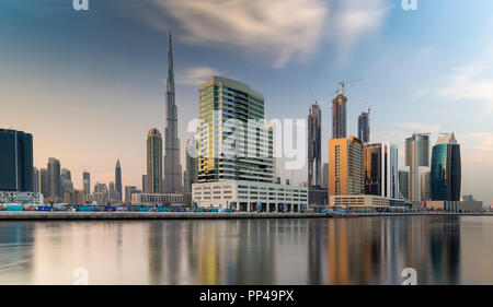 View of Burj Khalifa and Dubai Downtown on sunset as shot over the Dubai water canal Stock Photo