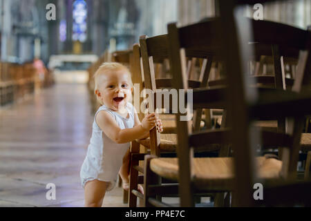 Little child in big cathedral, indoors Stock Photo