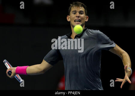 Dominic Thiem of Austria returns the ball to Roberto Bautista of Spain during the St. Petersburg Open ATP tennis tournament semi final match in St.Petersburg. Stock Photo