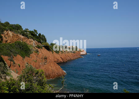 the corniche de l'esterel seen from the sea on board a ferry that runs along the entire French coast between cannes and saint-raphael Stock Photo