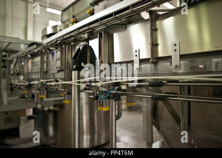 Production of the bottles plastic The Technological line on production of the plastic bottles. Stock Photo